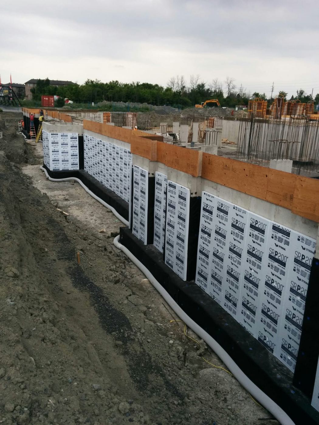 Drainage membrane being installed on a residential foundation